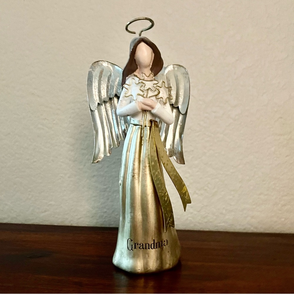 Angel statute holding 3 Stars